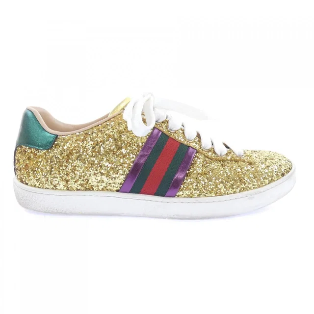 Gucci Sneakers Gold in Gold from The Reluxe