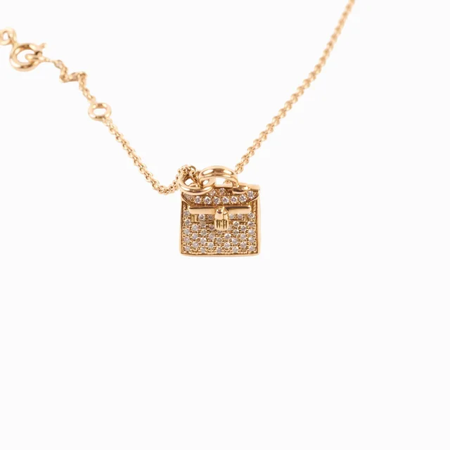 Hermès Kelly Amulette Necklace 18K Rose Gold in Pink from The Purse Affair