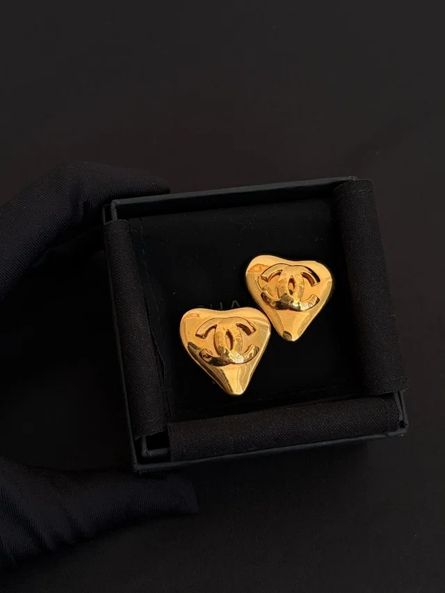 Chanel Gold Glossy Heart CC Ear Clips in Gold from Luxury Promise