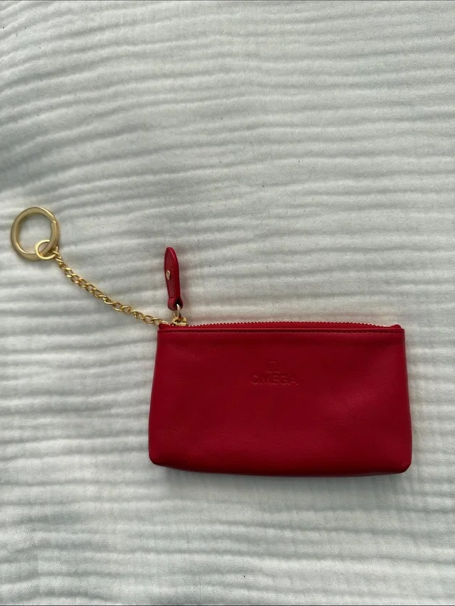 Omega Red Leather Zip Pouch With Gold Chain Keyring in red|gold Leather from Poshmark, photo 1 of 1