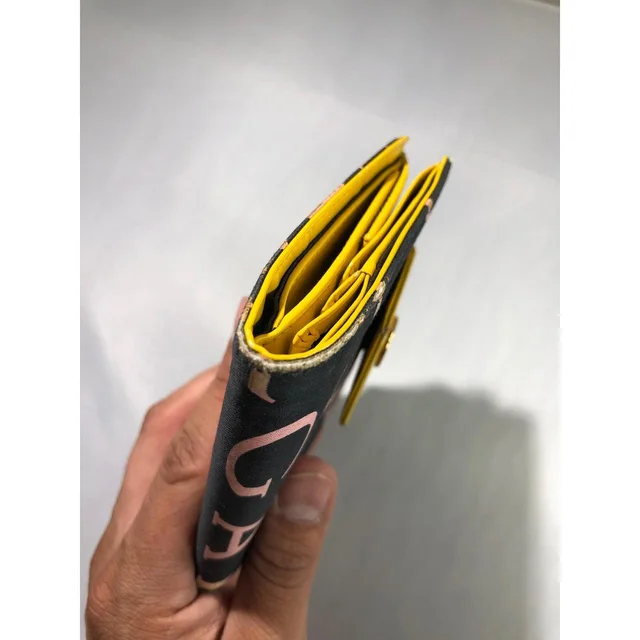 Bvlgari Women's Wallets - Black/Yellow in yellow|black from Depop, photo 9 of 9
