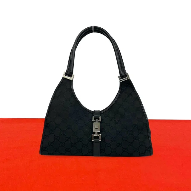 Gucci Jackie GG Canvas Leather Shoulder Bag Black in Black Canvas from The Reluxe