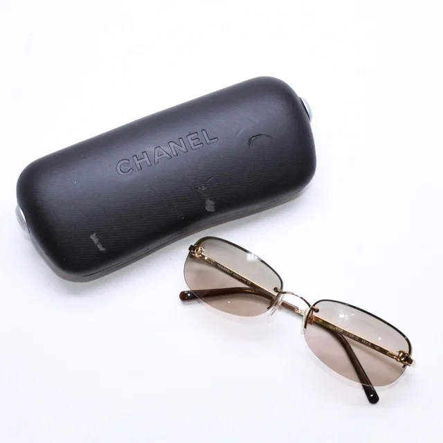 Chanel Rimless Sunglasses Side CC Logo Metal Brown Gold Eyewear in Brown from The Reluxe