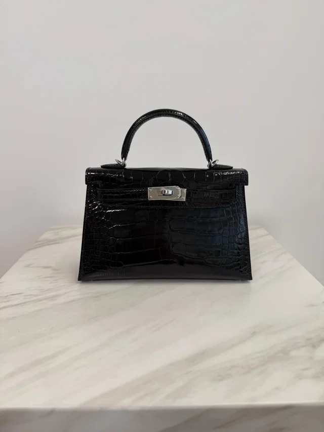 Hermès Mini Kelly Black Shiny Alligator Palladium Hardware in Black Crocodile from Luxury Promise