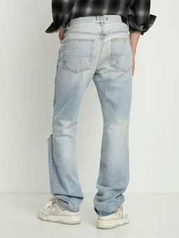 Amiri Flare jeans with ripped details in 100% Cotton, photo 3 of 5 from LUISAVIAROMA