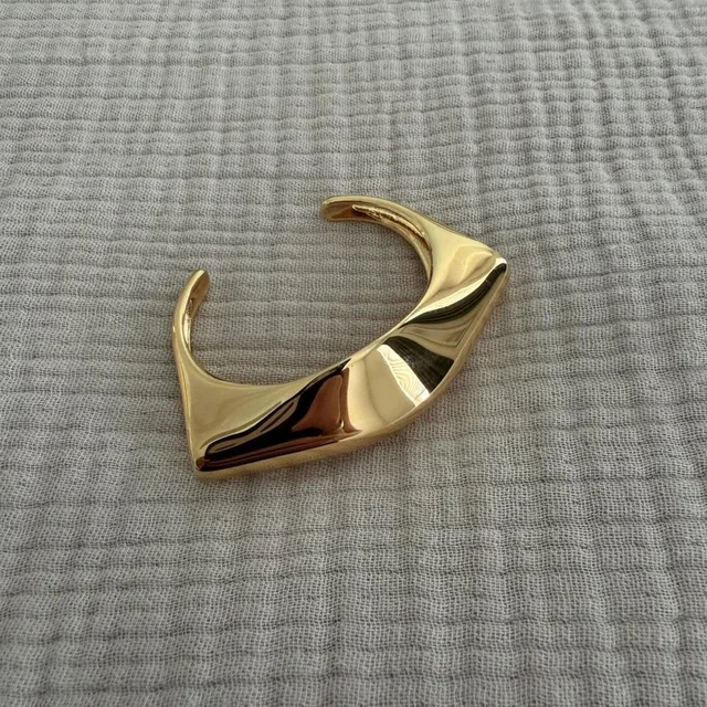 Khaite Women's Bracelet - Gold in gold from Depop, photo 1 of 1