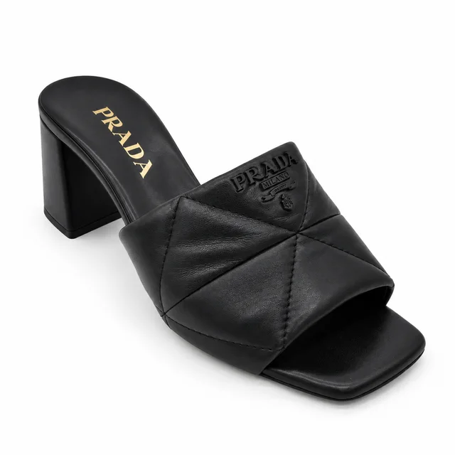 Prada Black Quilted Leather Logo Mules in Black Leather from Clotheshorse Anonymous