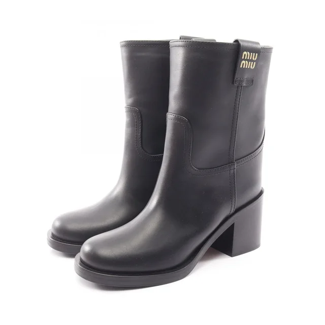 Miu Miu Boots Logo Leather in Leather from The Reluxe