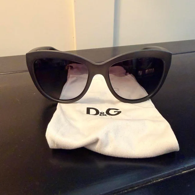 Dolce & Gabbana Women's Cat eye Sunglasses - Black/Brown in black|red|brown from Depop, photo 2 of 6