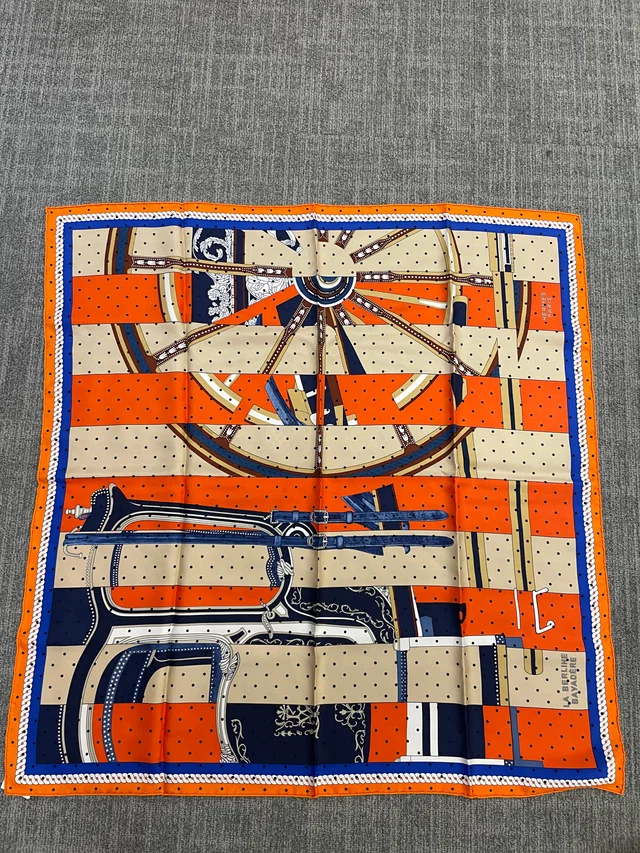 Hermès Silk 90-5 – Abstract Wheel Pattern in Orange, Navy, and Cream in White Silk from Luxury Promise