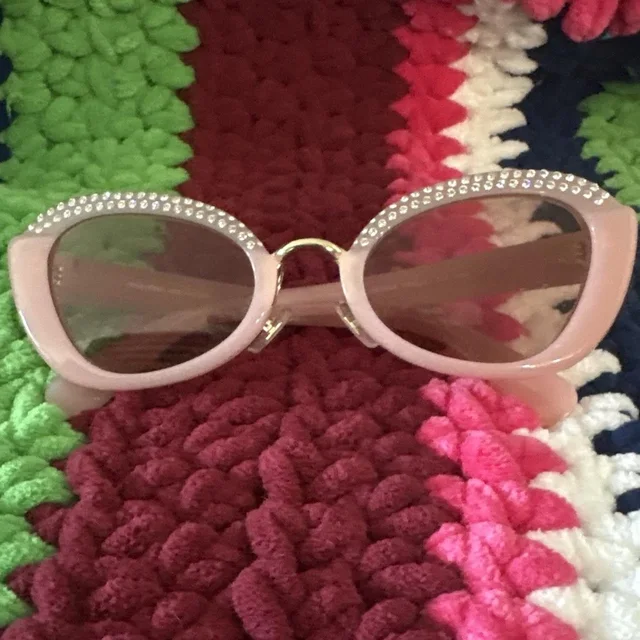 Miu Miu Women's Cat eye Sunglasses - Pink in pink from Depop, photo 1 of 1