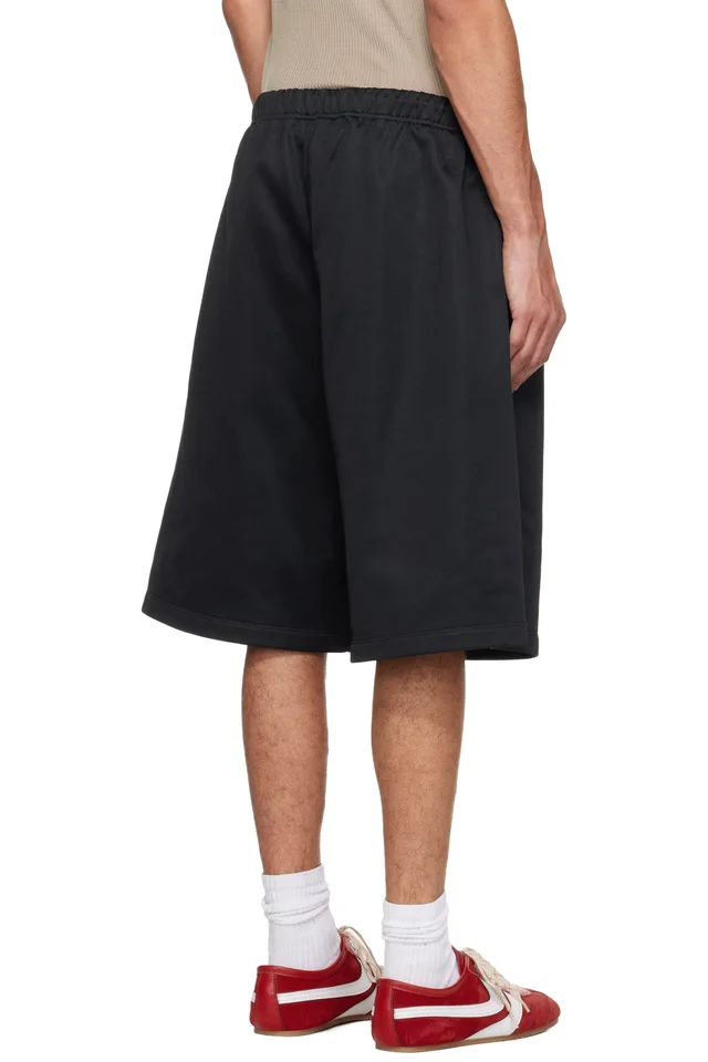 Fear of God ESSENTIALS Black Holiday Satin Fleece Relaxed Shorts, photo 3 of 4 from SSENSE