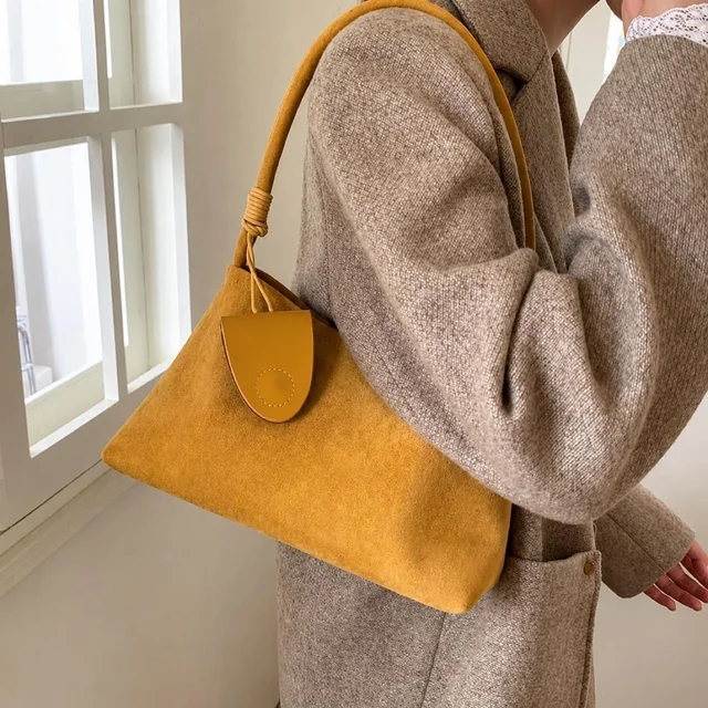 The Row Women's Shoulder bags - Yellow/Tan in yellow|neutral|brown from Depop, photo 1 of 1