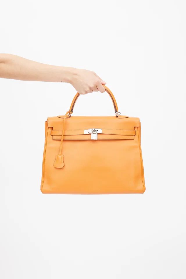 Hermès 2011 Orange H Swift Kelly Retourne 35 Bag in Orange Swift leather from VSP Consignment