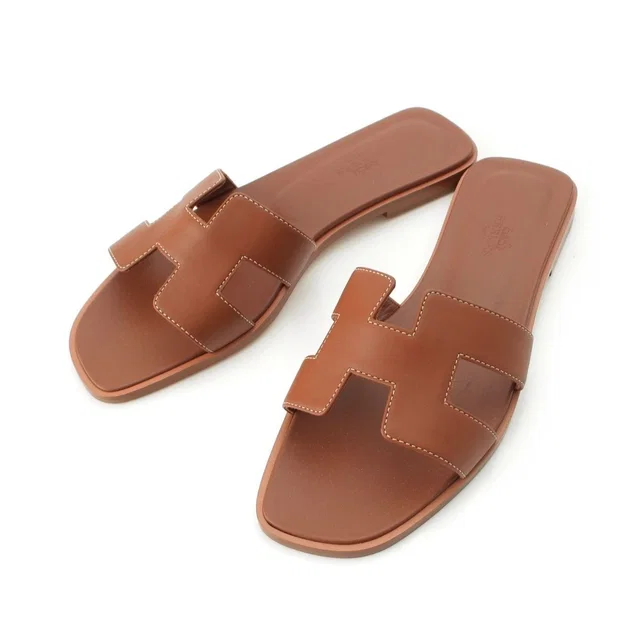 Hermès Oran Leather H Motif Flat Sandals Brown in Brown Leather from The Reluxe