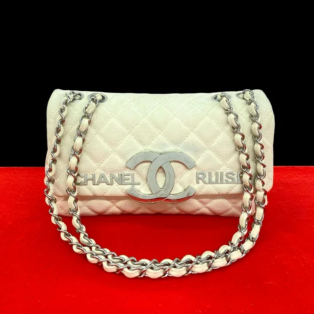 Chanel Cruise Collection Quilted CC Logo Canvas Shoulder Bag Ivory in White Canvas from The Reluxe