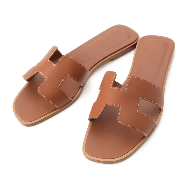 Hermès Oran Leather Sandals Gold in Gold Leather from The Reluxe