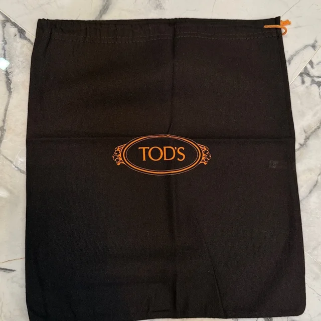 Tod's Dark Chocolate Brown With Orange Logo On The Front, Brand New in brown|red from Poshmark