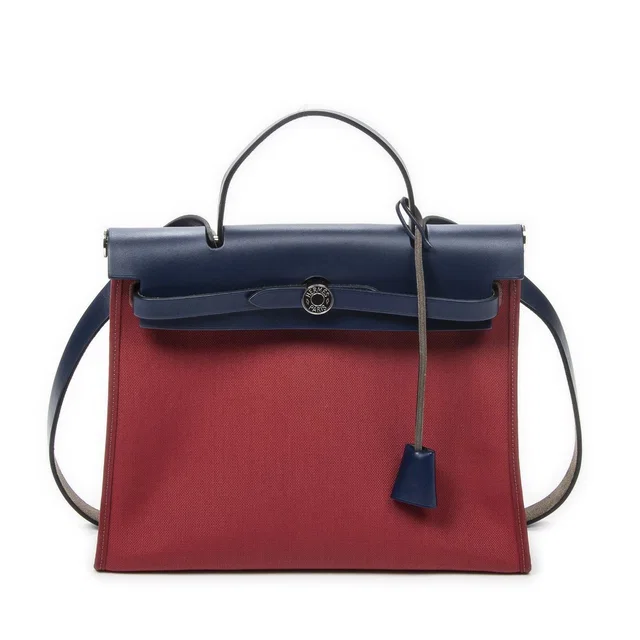 Hermès Herbag Zip Red Blue Toile Officier Handbag in Red from The Reluxe