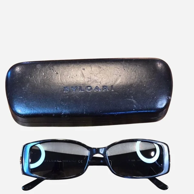 Bvlgari Women's Sunglasses - Black/Gold in black|gold from Depop, photo 1 of 1