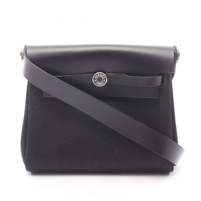Hermès Shoulder Bag Herbag Zip Mini Black Canvas Leather in Black Canvas from The Reluxe