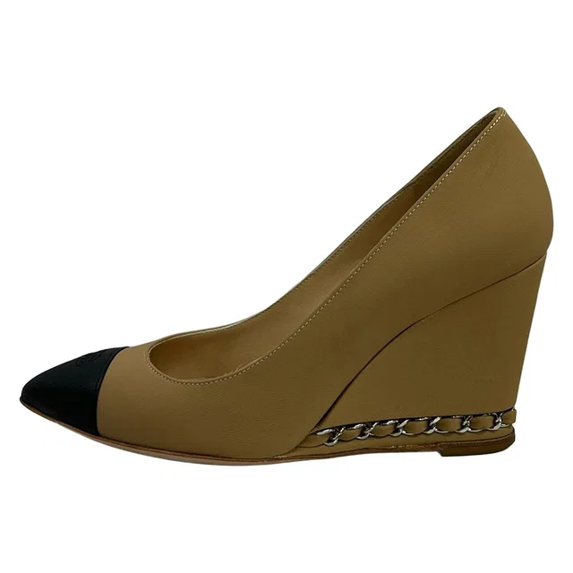 Chanel Pumps Beige Black CC Logo Wedge Sole Leather Heels in Black Leather from The Reluxe