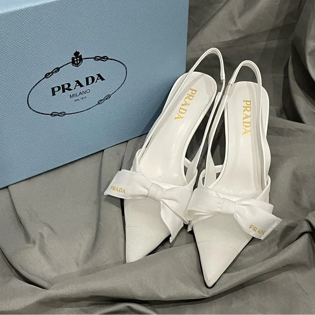 Prada Women's White Heels in white Canvas from Poshmark