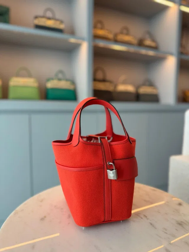 Hermès Picotin 18 Orange Field Canvas and Swift in Orange Swift leather from Luxury Promise