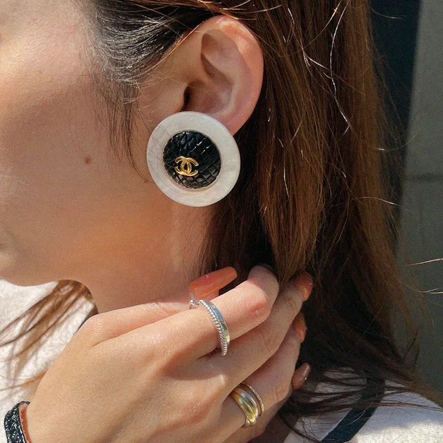 Chanel Round CC Mark Bicolor Earrings White/Black in Black from VINTAGE QOO TOKYO