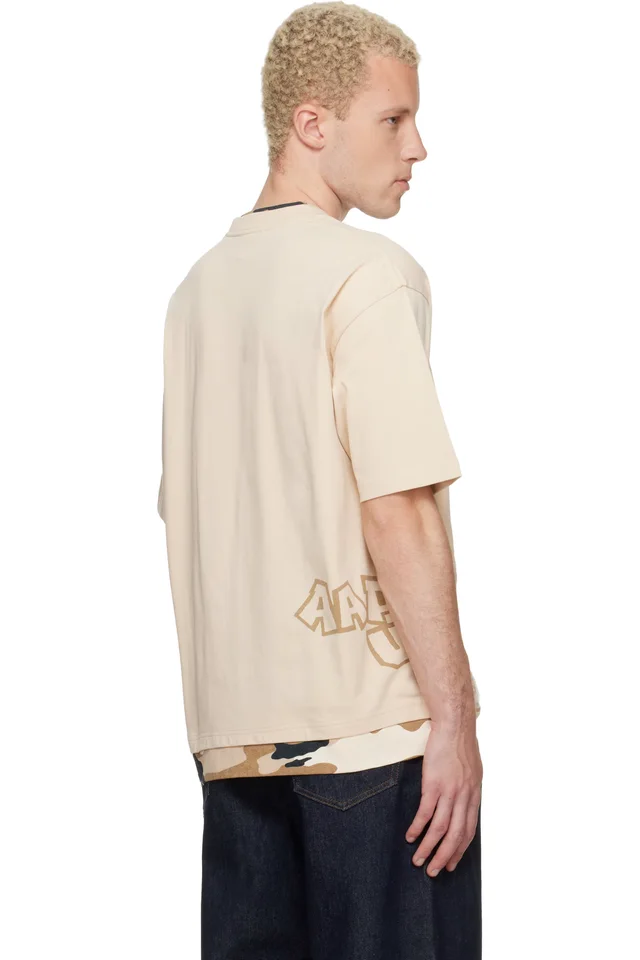 AAPE by A Bathing Ape Beige 'AAPEUNVS' Graphic T-shirt, photo 3 of 4 from SSENSE