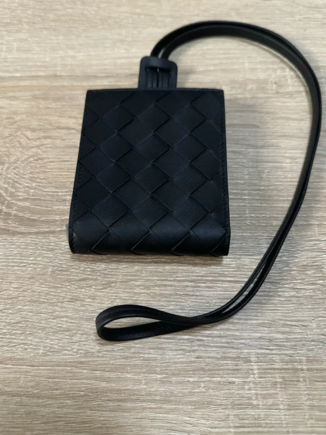 Bottega Veneta Wallet On Strap in black from Grailed, photo 1 of 1