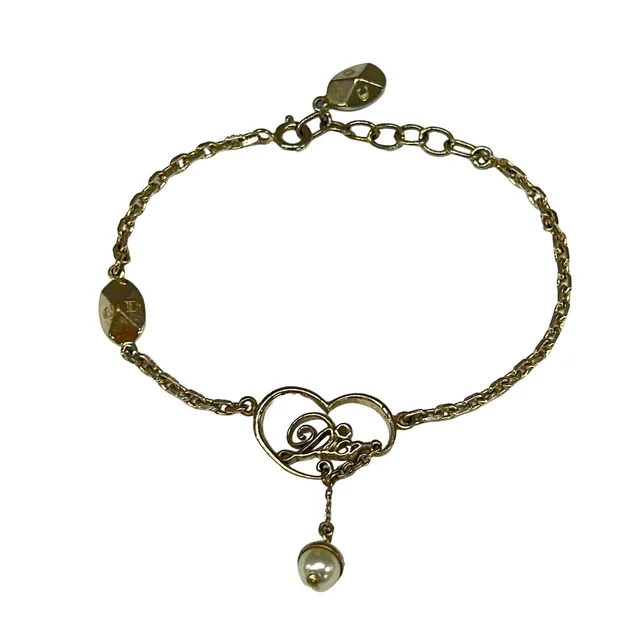 Dior Bracelet Gold Ivory in White from The Reluxe