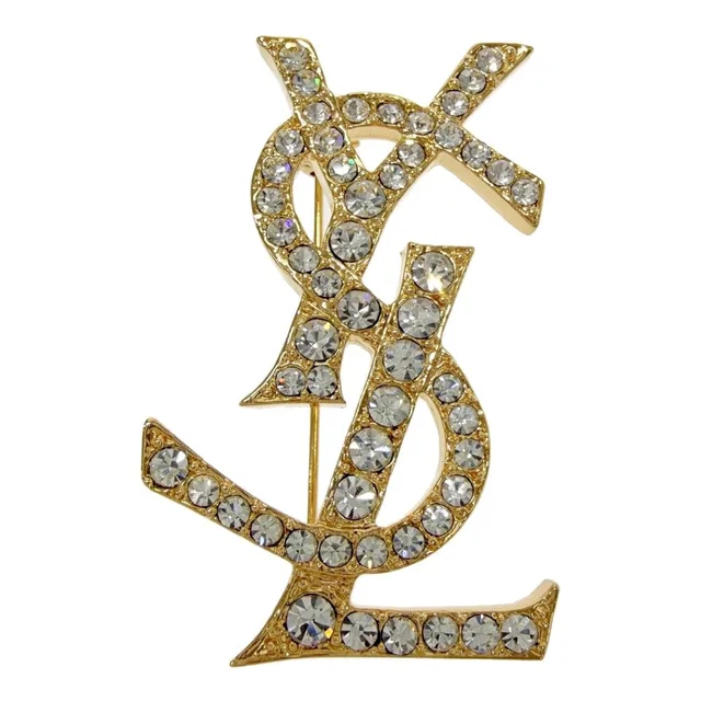 Saint Laurent Rhinestone Logo Brooch Gold in Gold from The Reluxe