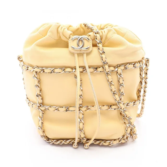 Chanel Shoulder Bag CC Logo Drawstring Light Yellow Lambskin Chain in Yellow Lambskin from The Reluxe