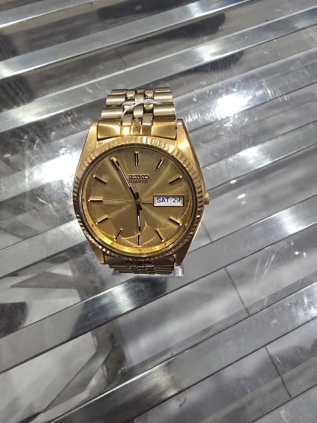 Seiko Men's Quartz Watch - Day-Date Display in gold from Poshmark