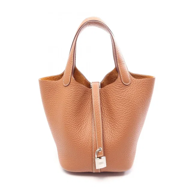 Hermès Picotin Lock PM Gold Handbag in Gold Clemence leather from The Reluxe