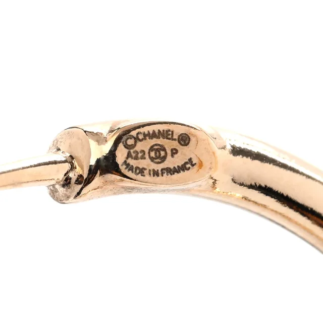 Chanel Metal Textured CC Hoop Earrings Gold in Gold from FASHIONPHILE, photo 4 of 5