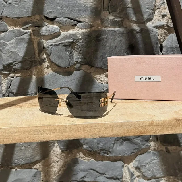 Miu Miu Smu 54yu Logo Black Shield Aube Sunglasses in black from Grailed