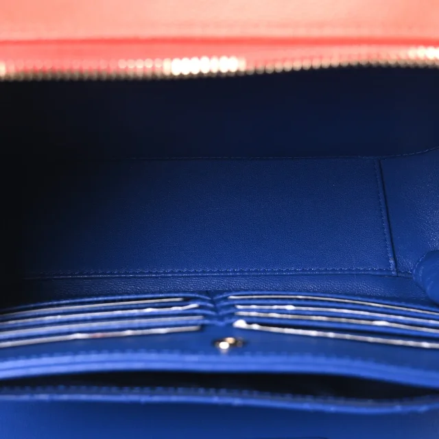 Chanel Caviar Quilted Large CC Filigree Vanity Case Blue White Red in White Caviar leather from FASHIONPHILE, photo 6 of 11