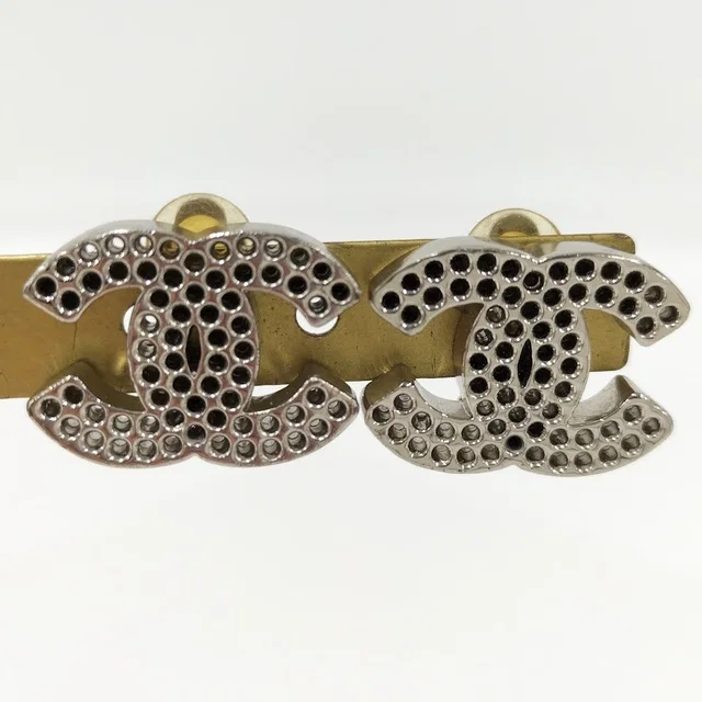 Chanel Earrings CC Logo Perforated Plated Silver in Silver from The Reluxe