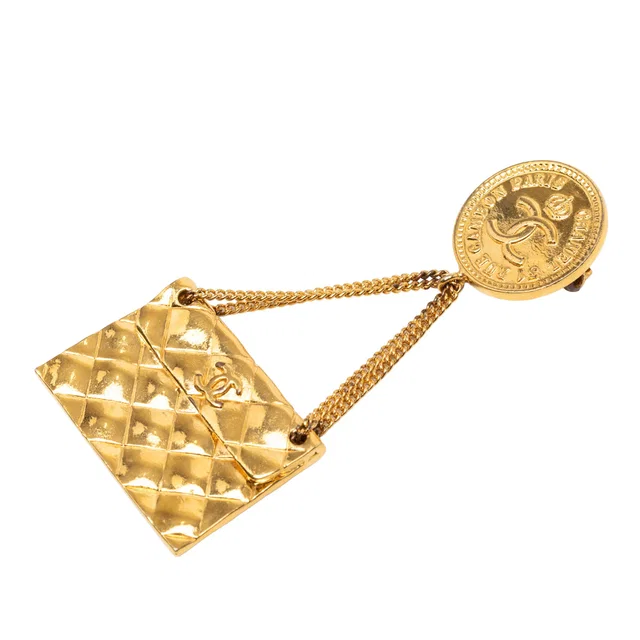 Gold Chanel CC Gold Plated Quilted Flap Bag Medallion Brooch in Gold from Designer Revival