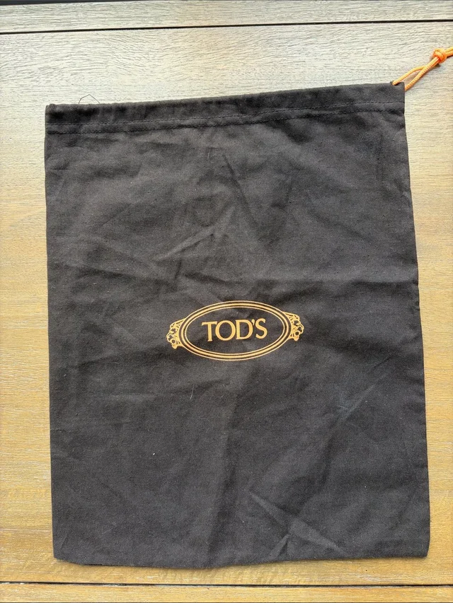 Tod's Brown Drawstring Dust Bag With Logo in brown|red from Poshmark, photo 1 of 1