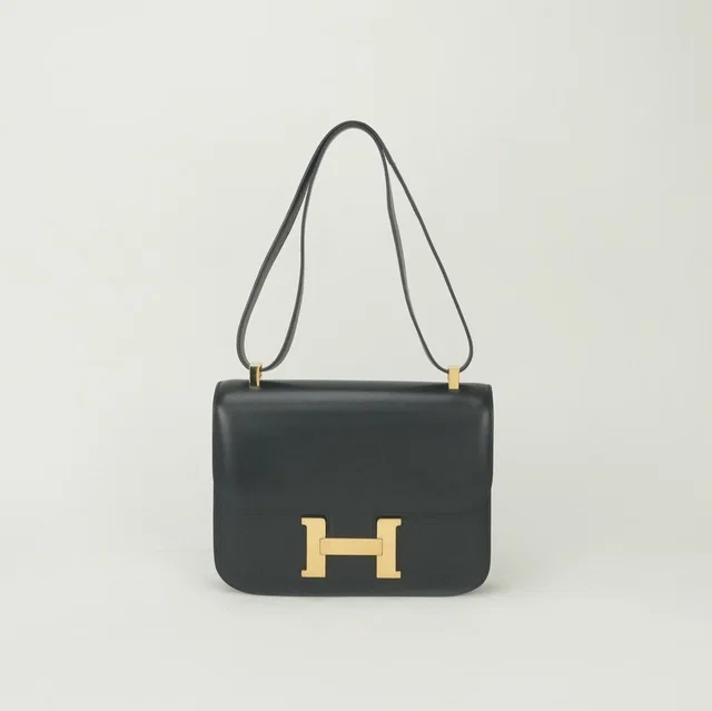 Hermès Constance 23 Shoulder Bag Box Calf Noir Black Gold in Black Box leather from The Reluxe