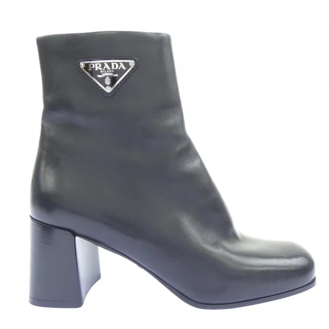 Prada Triangle Logo Boots in Calfskin from The Reluxe