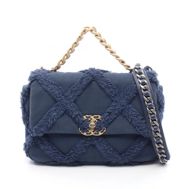 Chanel Shoulder Bag 19 Dizeneuf Quilted Navy Canvas 19 Chain in Navy Canvas from The Reluxe