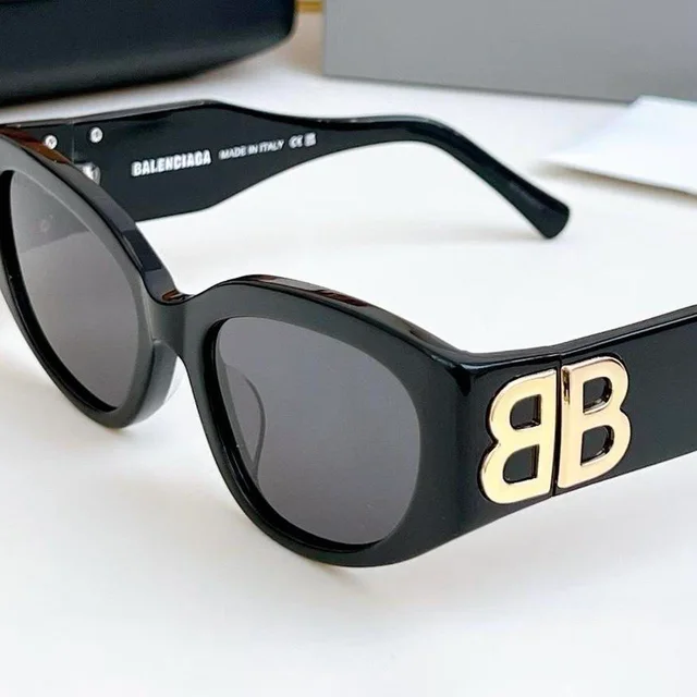 Balenciaga Women's Sunglasses - Black/Brown in black|brown|red from Depop, photo 1 of 1