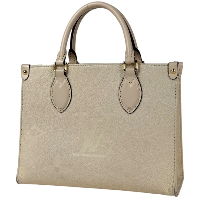 Louis Vuitton On The Go PM Handle 2-Way Monogram Empreinte Cream Tote Bag in White from The Reluxe