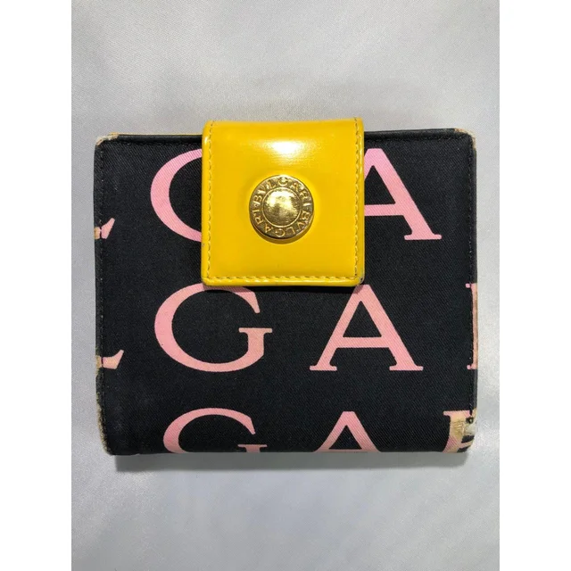 Bvlgari Women's Wallets - Black/Yellow in yellow|black from Depop, photo 2 of 9