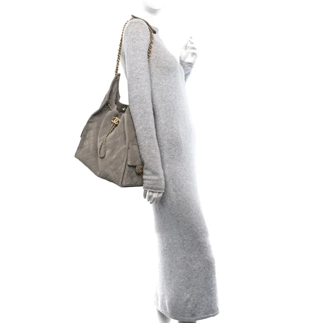 Quilted Medium Chanel 25 Handbag Dark Grey in Grey Suede from FASHIONPHILE, photo 2 of 9