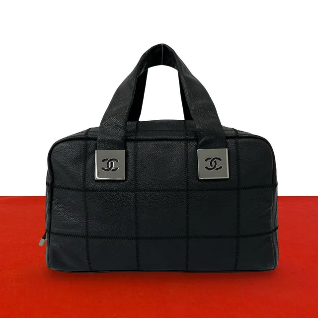 Chanel Choco Bar CC Logo Caviar Leather Mini Boston Bag Black in Black Caviar leather from The Reluxe